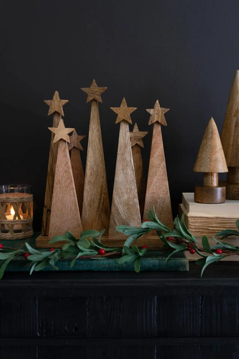 Seven Wooden Christmas Trees on a Base